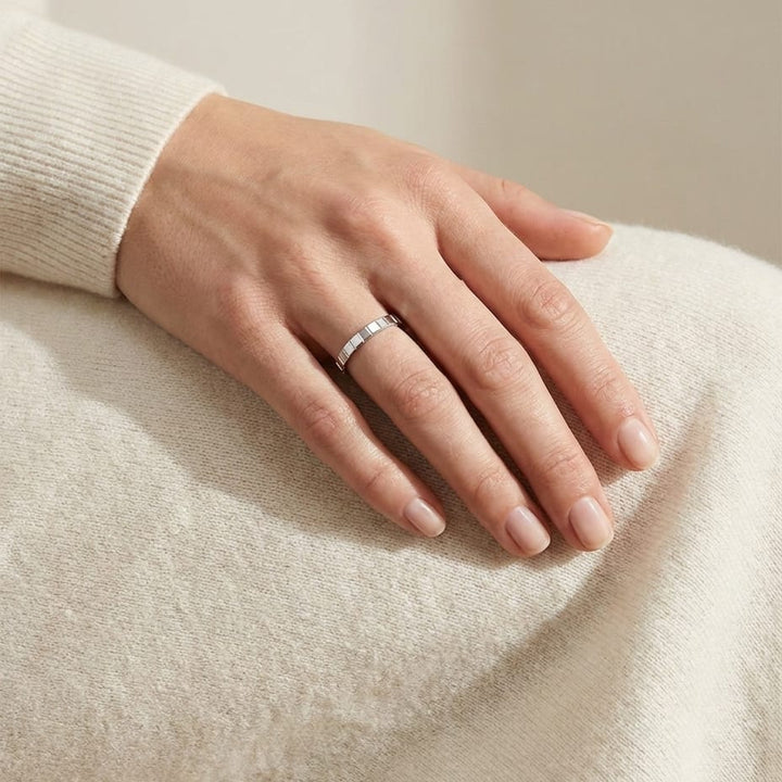 2mm High Polish Carved Wedding Band in 14K White Gold, worn on hand, full view
