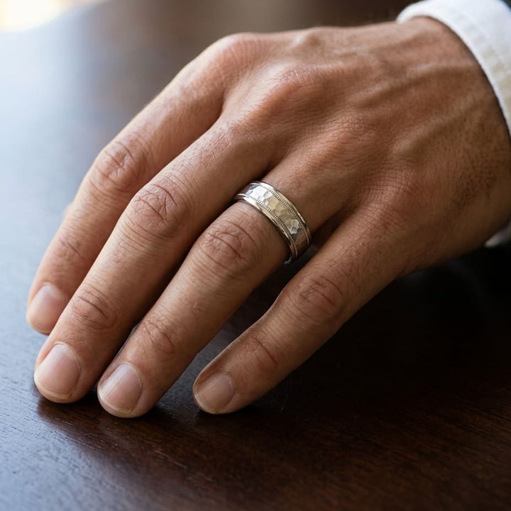 6mm Hammered Center High Polish Round Edge Carved Wedding Band in 14K White Gold, worn on hand, masculine close-up