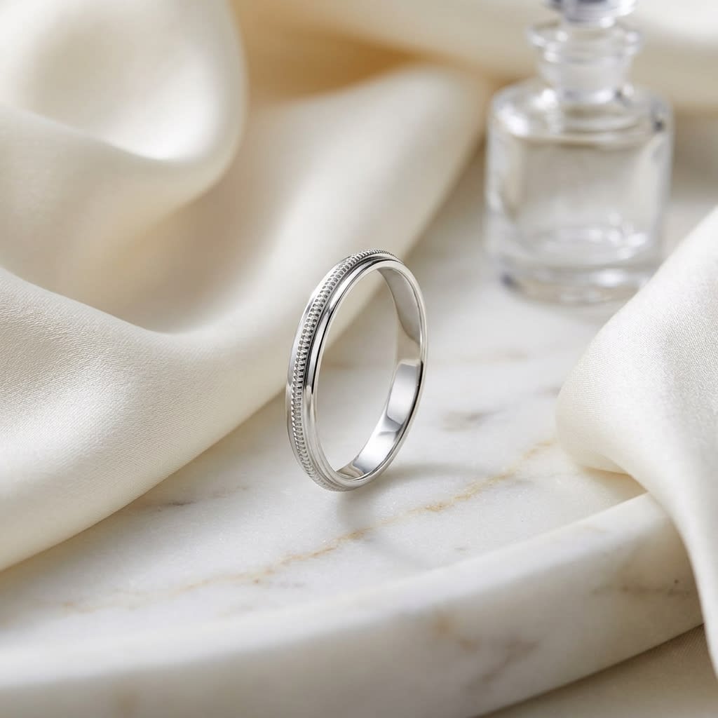 2mm High Polish Milgrain Round Edge Carved Wedding Band in 14K White Gold, on marble vanity tray with silk