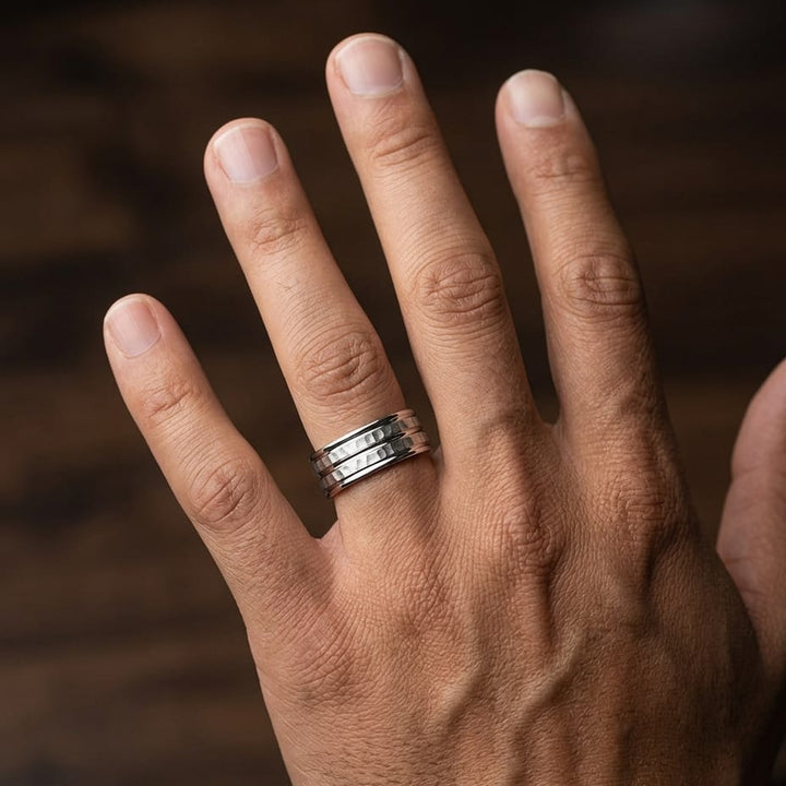 7.5mm High Polish Round Edge Carved Wedding Band in 14K White Gold, worn on hand, masculine close-up