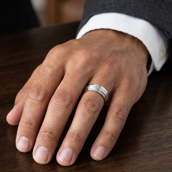 8mm Satin Finish Carved Wedding Band in 14K White Gold, worn on hand, masculine close-up
