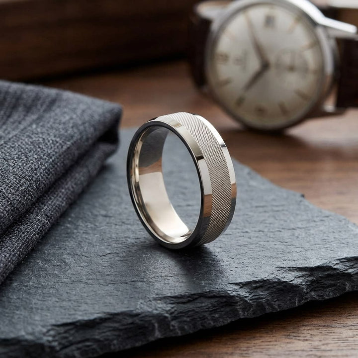 7mm High Polish Cross Hatch Center Carved Wedding Band in 14K White Gold, on walnut surface with pocket square