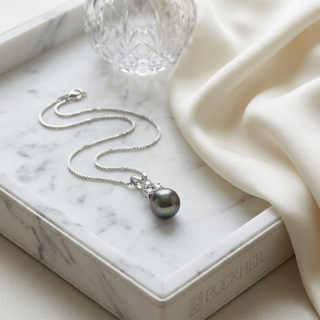 South Sea Pearl Pear Shape Pendant in 14K White Gold, on marble vanity tray with silk