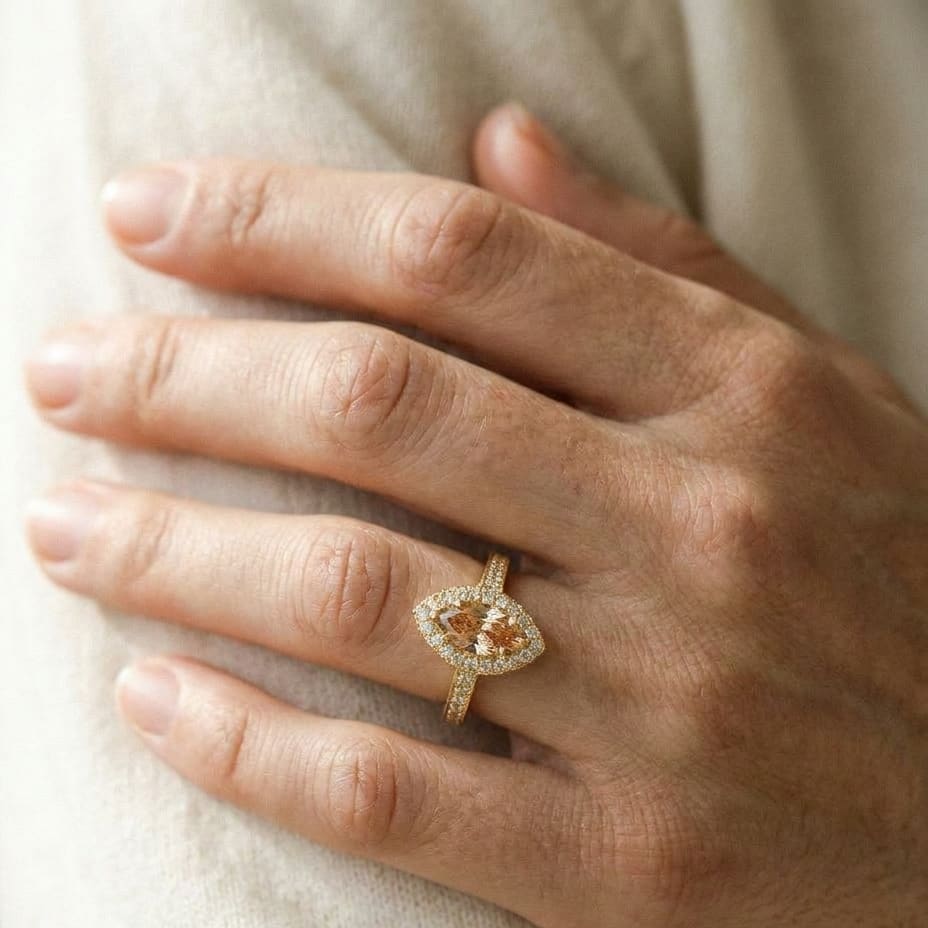 Morganite Marquise Halo Ring 14k Yellow Gold 0.24ctw, worn on hand, close-up