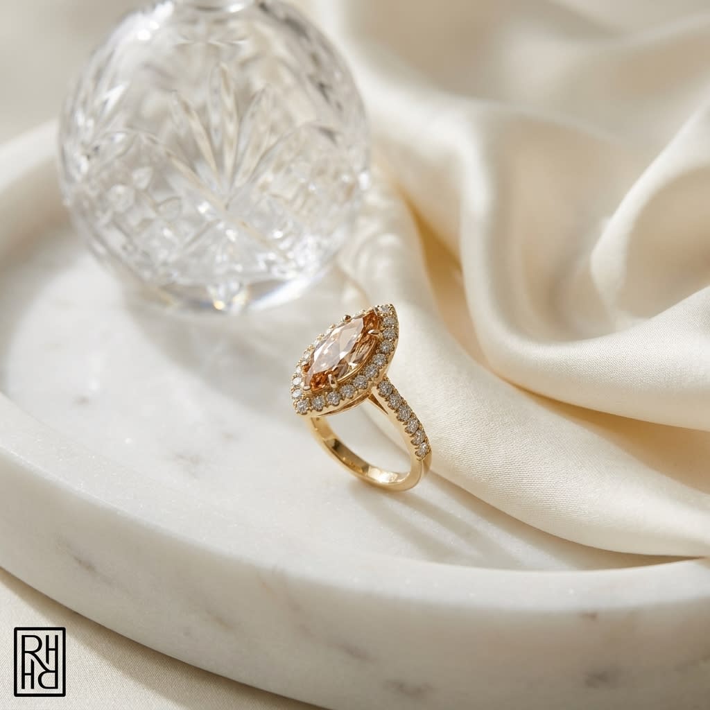 Morganite Marquise Halo Ring 14k Yellow Gold 0.24ctw, on marble vanity tray with silk