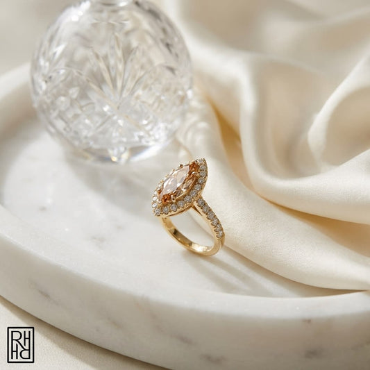 Morganite Marquise Halo Ring 14k Yellow Gold 0.24ctw, on marble vanity tray with silk