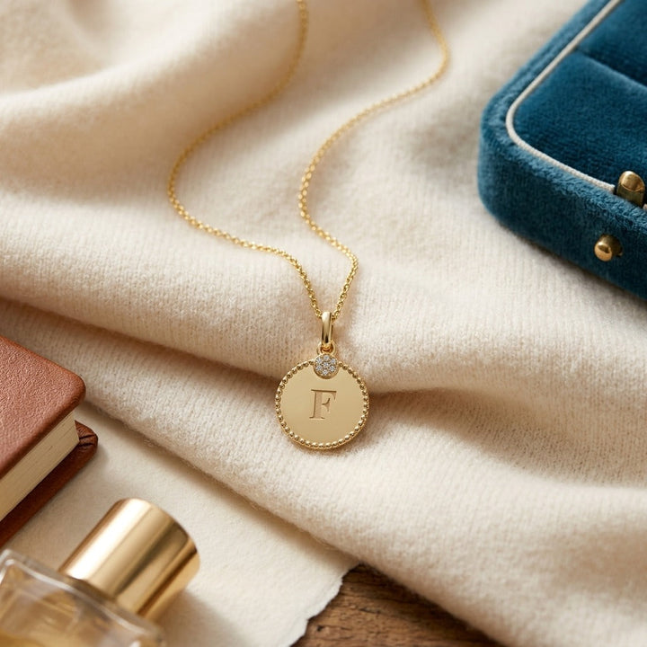 14K Gold Diamond Accent Initial Disc Pendant in 14K Yellow Gold - flat lay