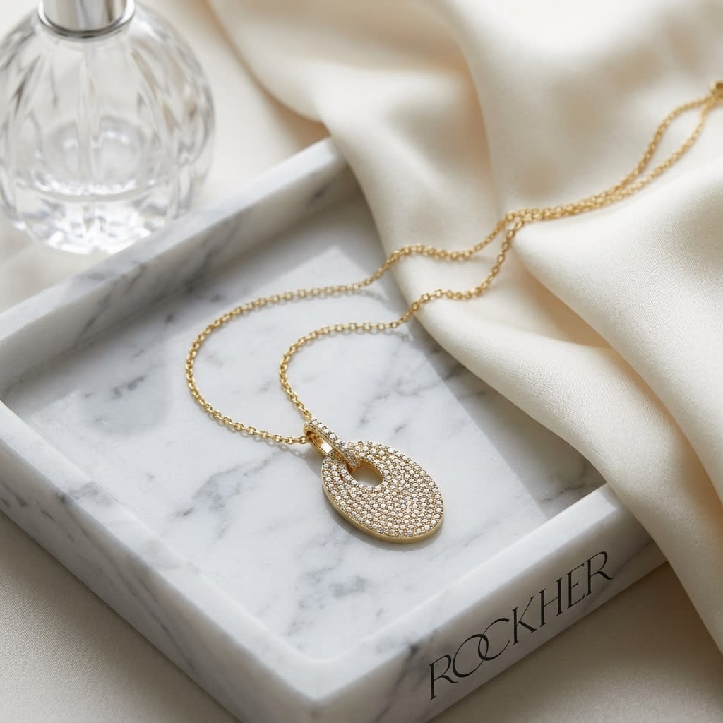 Natural Diamond Oval Pendant in 14K Yellow Gold, on marble vanity tray with silk