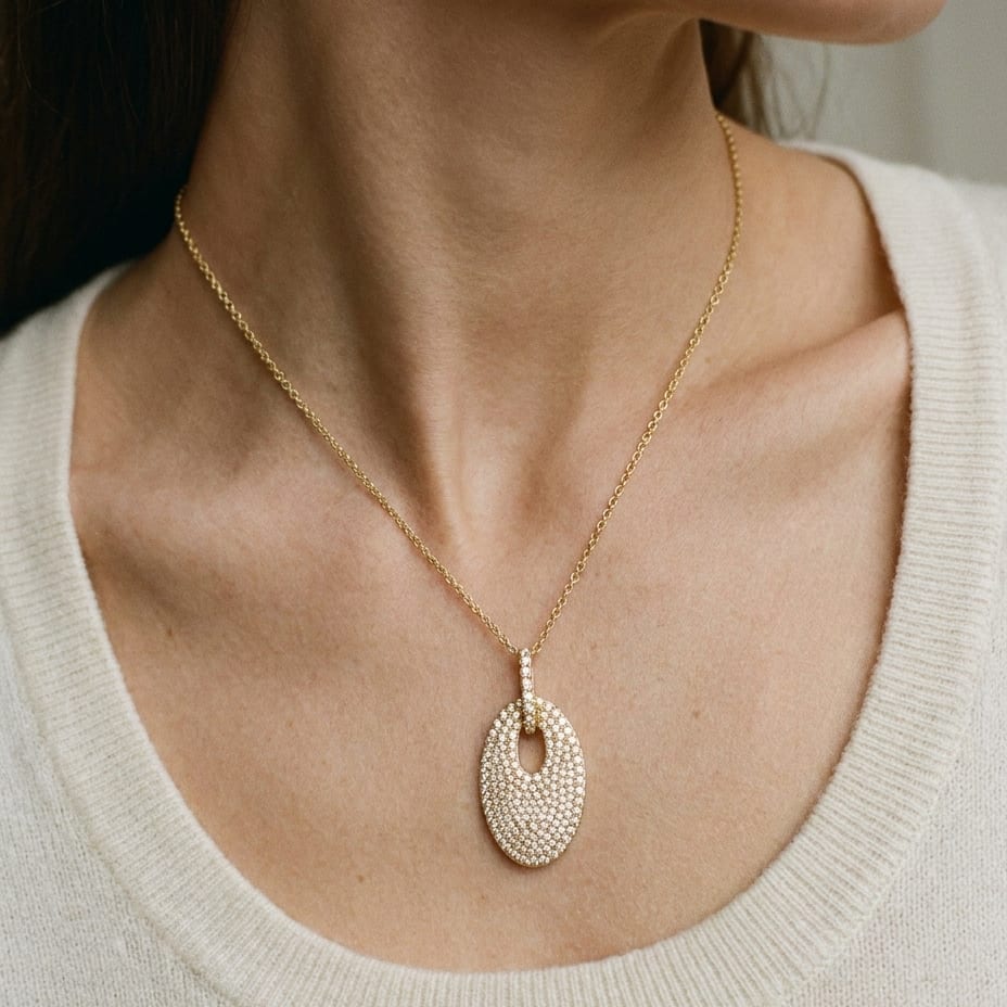 Natural Diamond Oval Pendant in 14K Yellow Gold, worn close-up portrait