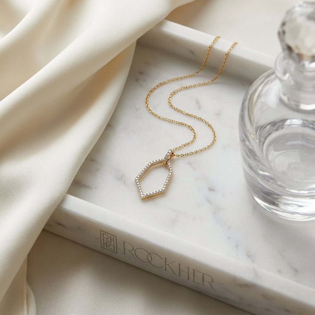 Diamond Open Kite Shield Pendant in 14k Yellow Gold 0.38ctw, 16-18 Inch Adjustable Cable Chain, on marble vanity tray with silk
