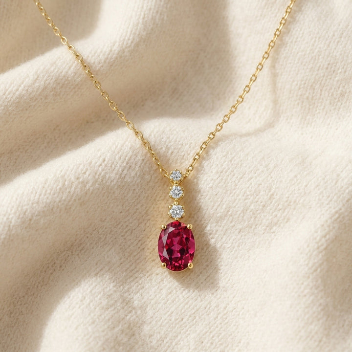 Rhodolite Garnet & Diamond Pendant 0.09ctw in 14K Yellow Gold - flat lay