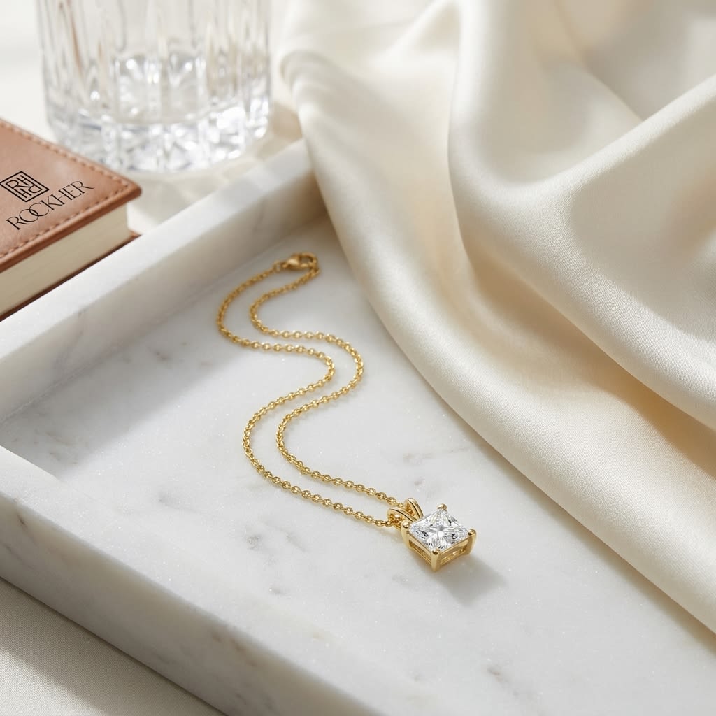 Natural Princess Solitaire Diamond Pendant, 1 ct. t.w. | 14K Yellow Gold | 4-Prong, on marble vanity tray with silk
