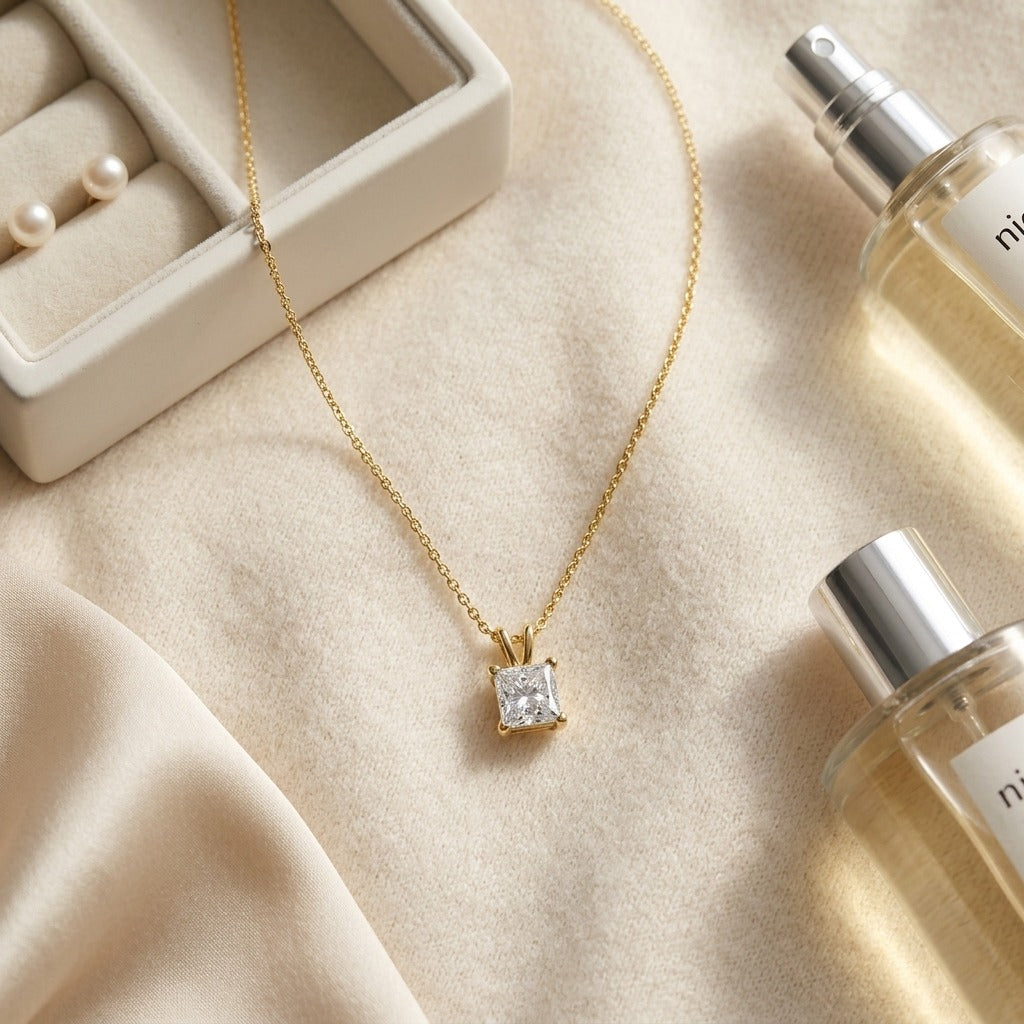Princess Diamond Solitaire Pendant in a 4-Prong Basket Setting, 1ct. T.w. in 14K Yellow Gold - flat lay