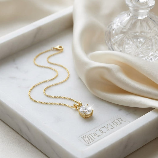 Natural Diamond Round Brilliant Solitaire Pendant in 14K Yellow Gold, 3 ct. t.w., on marble vanity tray with silk