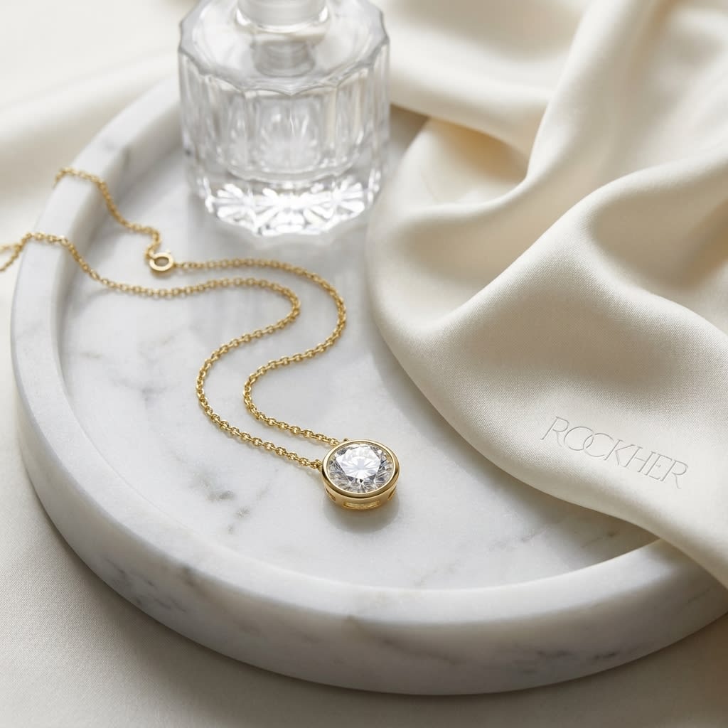Natural Diamond Round Brilliant Solitaire Pendant in 14K Yellow Gold, 4 ct. t.w., on marble vanity tray with silk