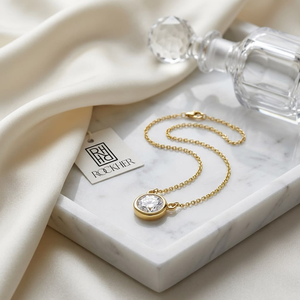 Natural Diamond Round Brilliant Solitaire Pendant in 14K Yellow Gold, 4 ct. t.w., on marble vanity tray with silk