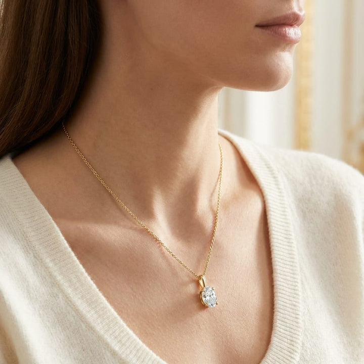 Natural Diamond Oval Solitaire Pendant in 14K Yellow Gold, 2 ct. t.w., worn close-up portrait