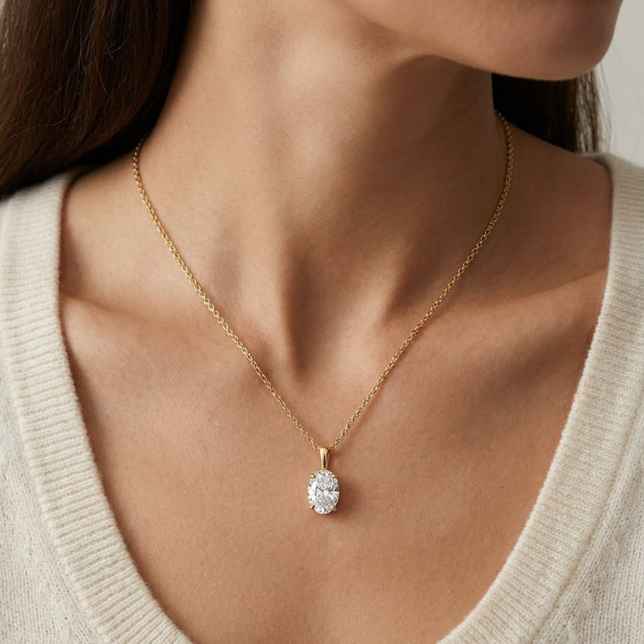 Natural Diamond Oval Solitaire Pendant in 14K Yellow Gold, 4 ct. t.w., worn close-up portrait