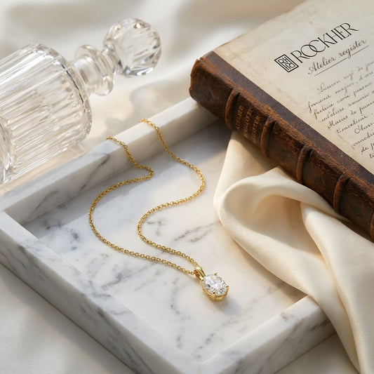 Natural Diamond Oval Solitaire Pendant in 14K Yellow Gold, 4 ct. t.w., on marble vanity tray with silk