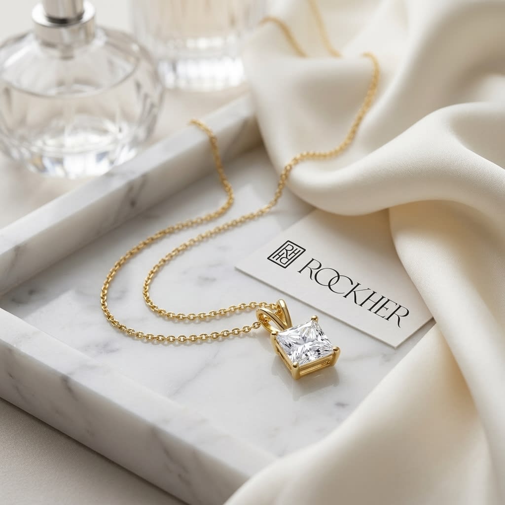 Natural Diamond Princess Cut Solitaire Pendant in 14K Yellow Gold, 2 ct. t.w., on marble vanity tray with silk