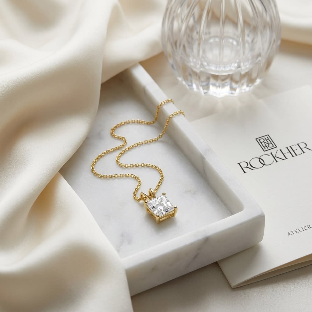 Natural Diamond Princess Cut Solitaire Pendant in 14K Yellow Gold, 1 ct. t.w., on marble vanity tray with silk