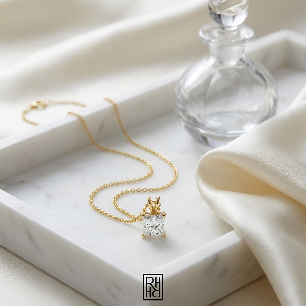 Natural Diamond Princess Cut Solitaire Pendant in 14K Yellow Gold, 2 ct. t.w., on marble vanity tray with silk