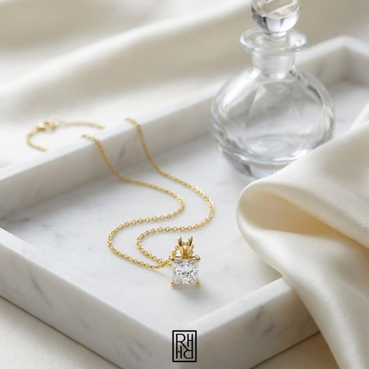 Natural Diamond Princess Cut Solitaire Pendant in 14K Yellow Gold, 2 ct. t.w., on marble vanity tray with silk
