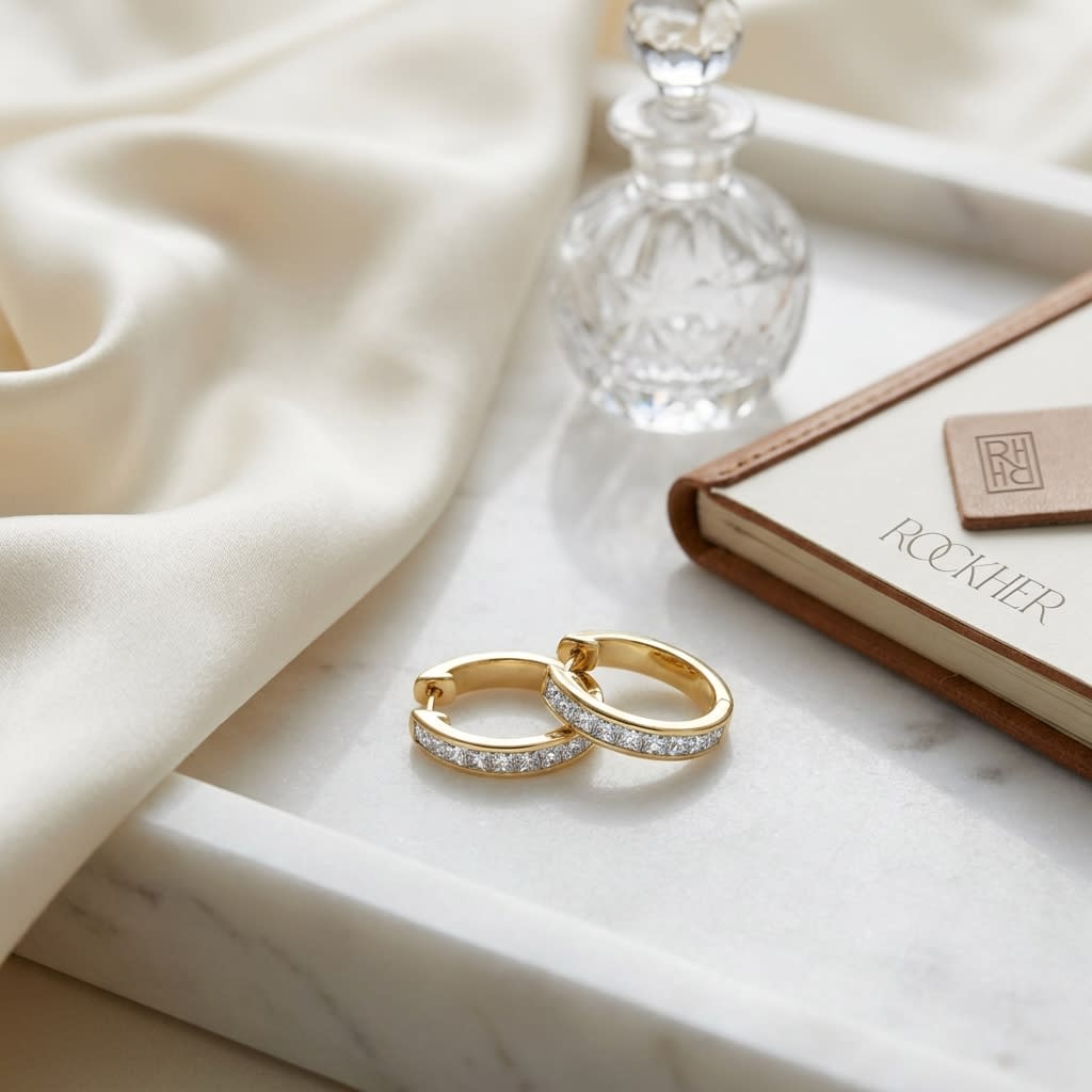 Diamond Princess Cut Channel Hinged Hoop Earrings in 14K Yellow Gold, on marble vanity tray with silk