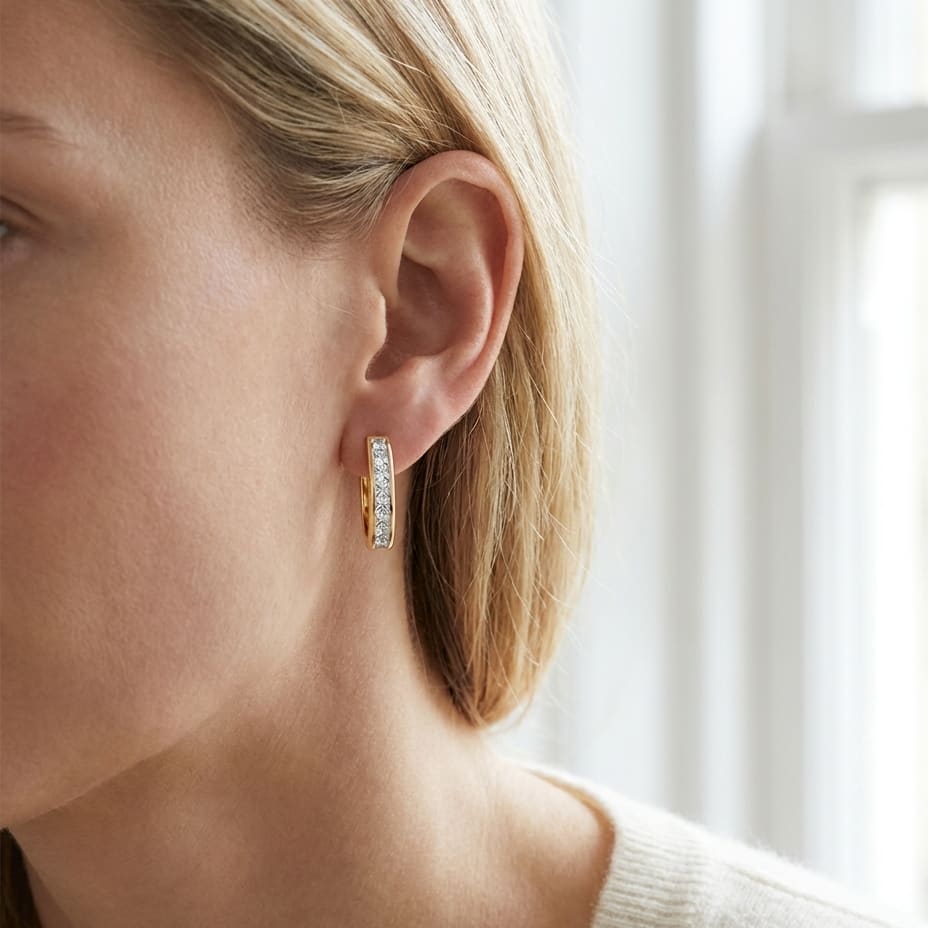 Diamond Princess Cut Channel Hinged Hoop Earrings in 14K Yellow Gold, worn close-up portrait