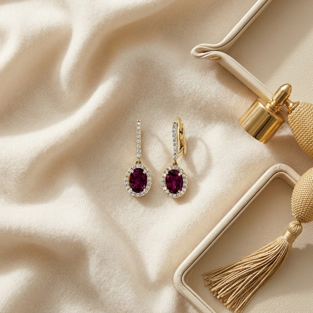 Rhodolite Garnet & Diamond Oval Halo Dangle Earrings with Pave Leverbacks in 14K Yellow Gold - flat lay