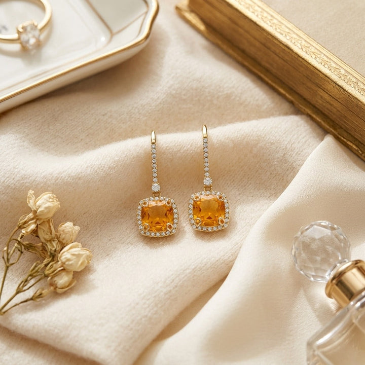 Citrine & Diamond Halo Cushion Dangle Earrings 1/4ctw in 14K Yellow Gold - flat lay
