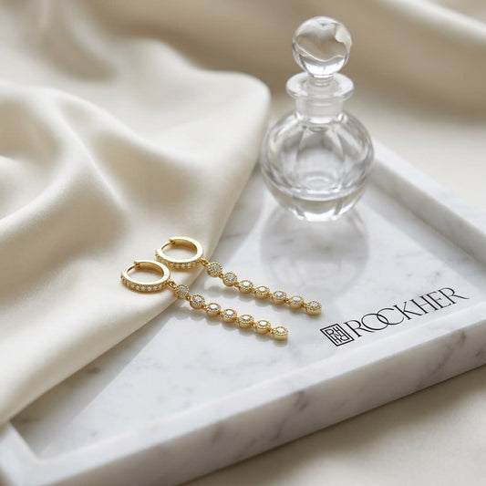 Diamond Milgrained Dangle Earring With Huggie Top in 14K Yellow Gold, on marble vanity tray with silk