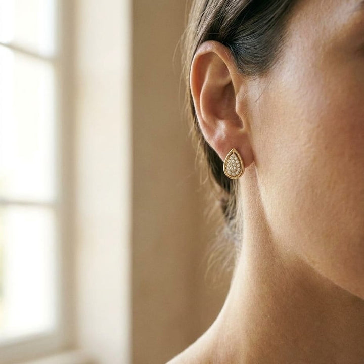 Diamond Teardrop Stud Earrings In 14k Yellow Gold 0.25ctw, worn close-up portrait
