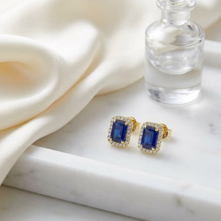 Sapphire Octagon Stud Earrings in 14K Yellow Gold, on marble vanity tray with silk
