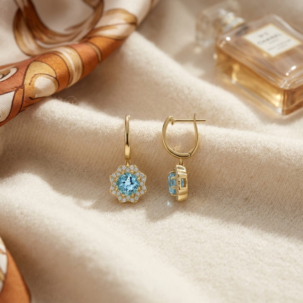 Blue Topaz & Diamond Round Brilliant Earrings in 14K Yellow Gold - flat lay