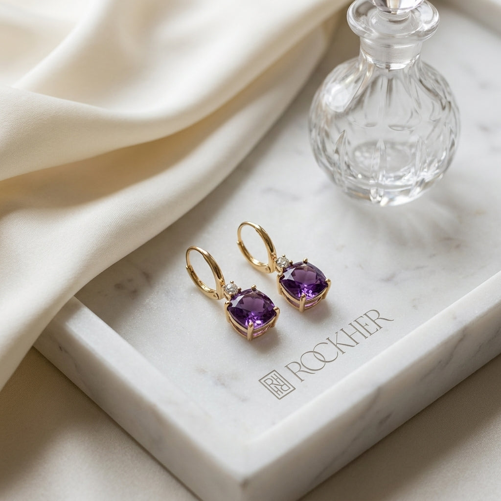 Cushion Amethyst and Diamond Leverback Earrings in 14k Yellow Gold 0.16ctw, on marble vanity tray with silk