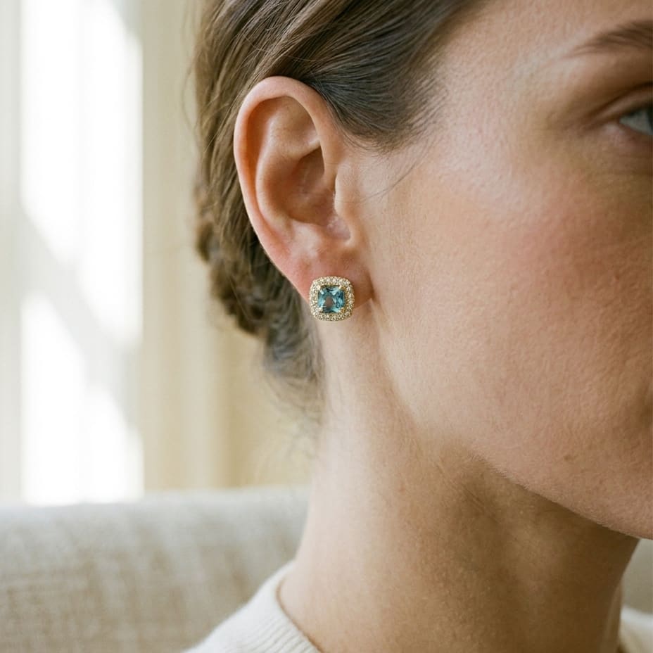 Swiss Blue Topaz and Diamond Earrings in 14K Yellow Gold, 0.20ct, worn close-up portrait