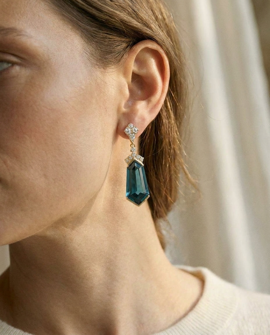London Blue Topaz and Diamond Shield Drop Earrings in 14k Yellow Gold 0.27ctw, worn close-up portrait