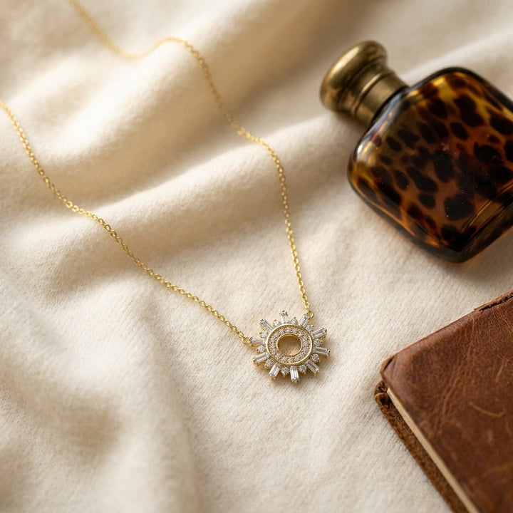 Diamond Round & Straight Baguette Starburst Necklace in 14K Yellow Gold - flat lay