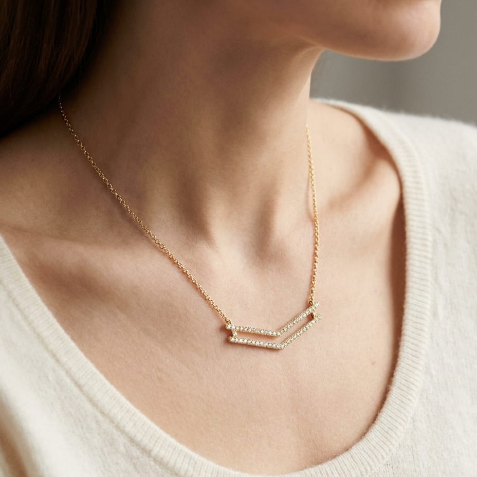 Diamond Micro-prong Set Double Chevron Necklace in 14K Yellow Gold, worn close-up portrait