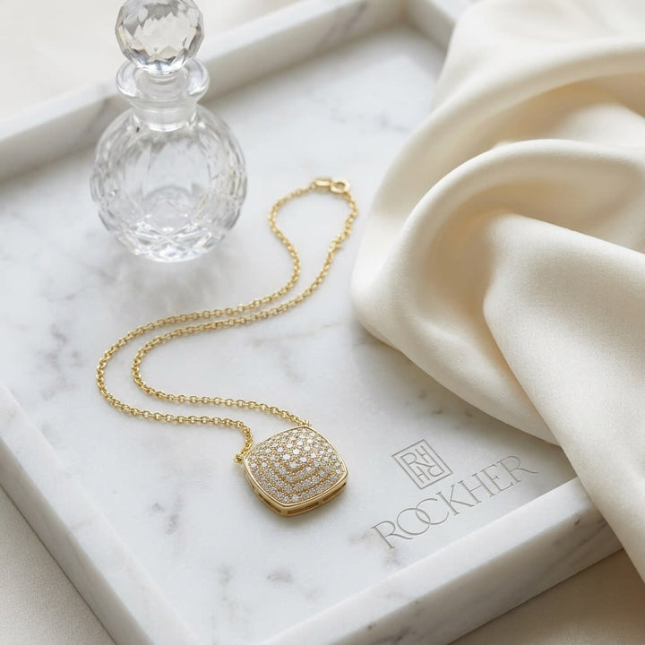 Diamond Pave Rounded Square Disk Necklace in 14K Yellow Gold, on marble vanity tray with silk