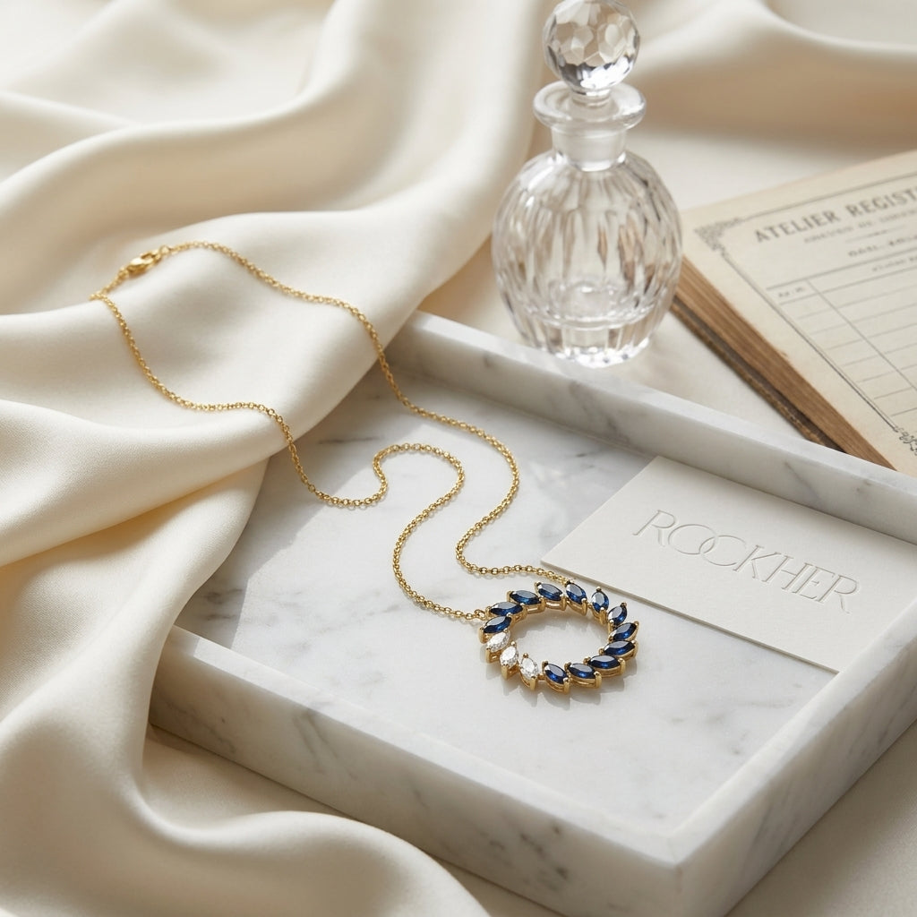Sapphire And Diamond Marquise Wreath Necklace In 14k Yellow Gold 0.21ctw, on marble vanity tray with silk