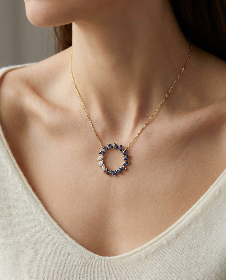 Sapphire And Diamond Marquise Wreath Necklace In 14k Yellow Gold 0.21ctw, worn close-up portrait