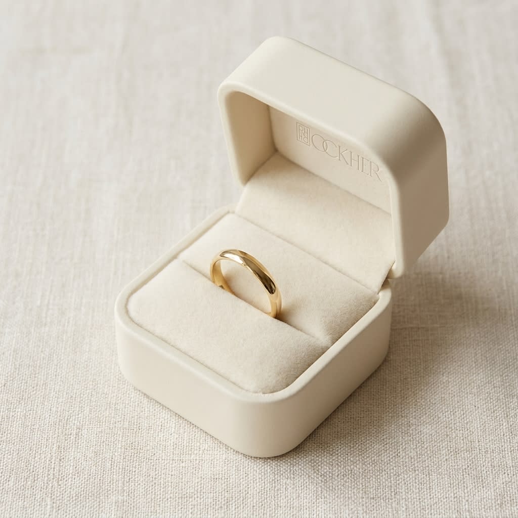 2mm Slightly Domed Traditional Oval Wedding Band in 14K Yellow Gold, in navy velvet jewelry box