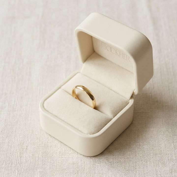 2mm Slightly Domed Traditional Oval Wedding Band in 14K Yellow Gold, in navy velvet jewelry box