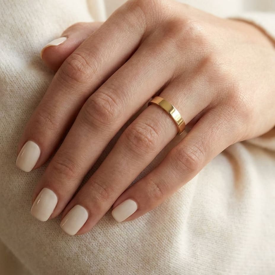 3mm Traditional Flat Wedding Band in 14K Yellow Gold, worn on hand, close-up