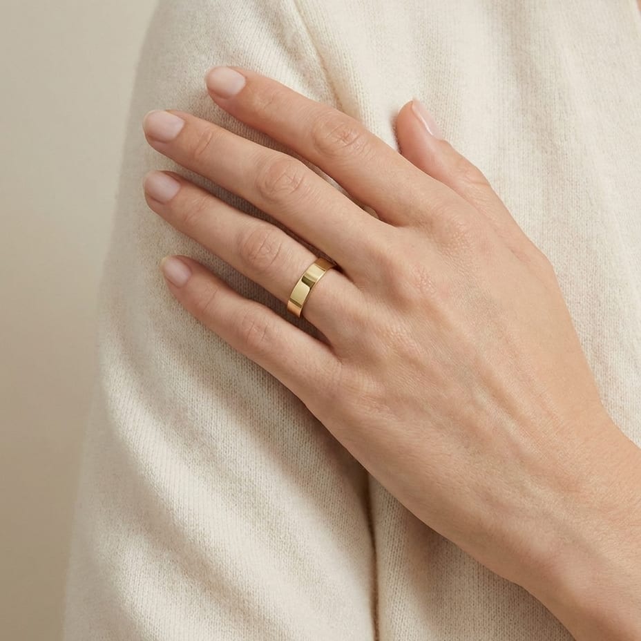 4mm Traditional Flat Wedding Band in 14K Yellow Gold, worn on hand, full view