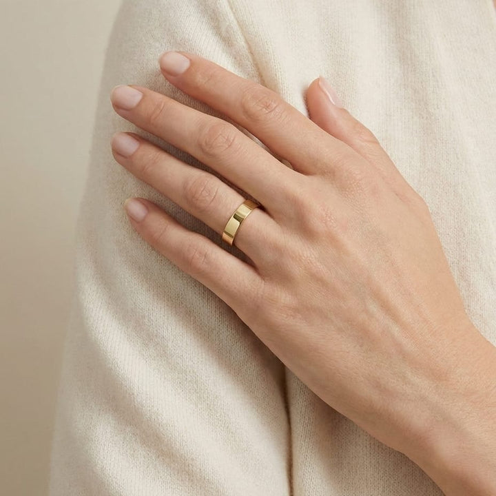 4mm Traditional Flat Wedding Band in 14K Yellow Gold, worn on hand, full view