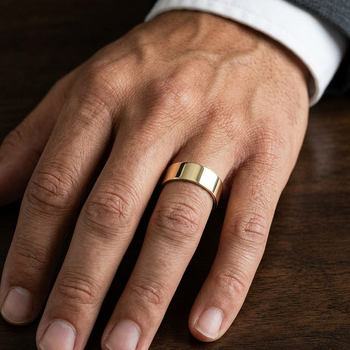 8mm Traditional Flat Wedding Band in 14K Yellow Gold, worn on hand, masculine close-up