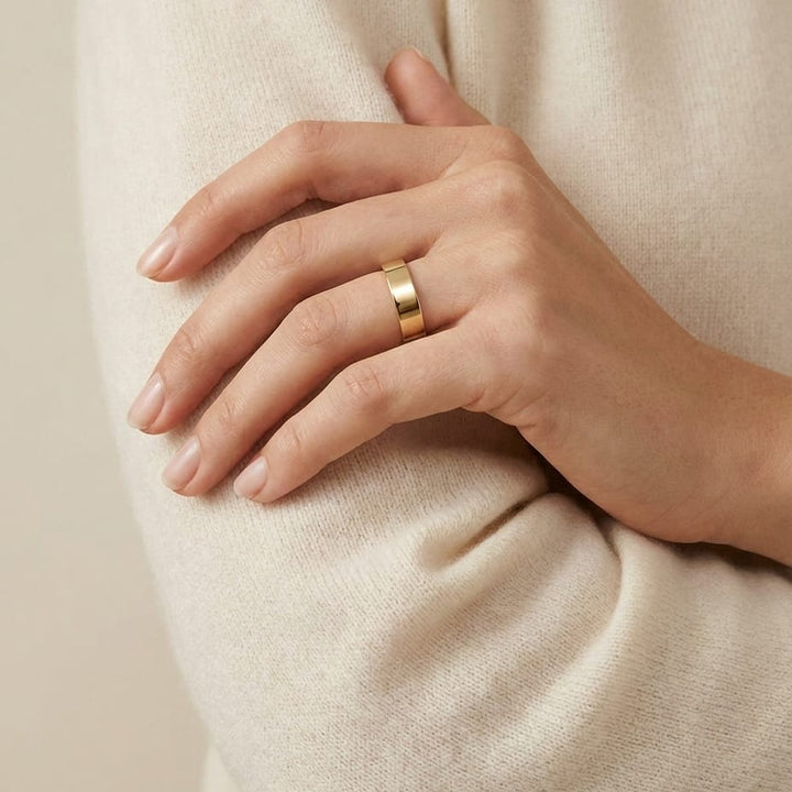 4mm Flat Comfort-Fit Wedding Band in 14K Yellow Gold, worn on hand, full view